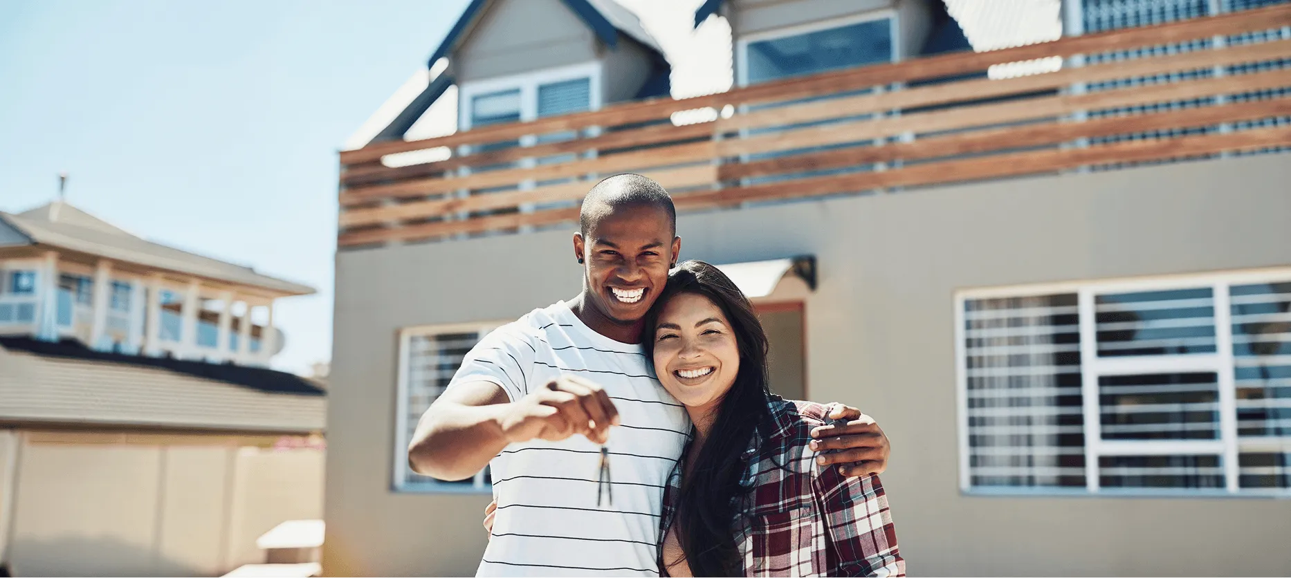 Happy couple with new home