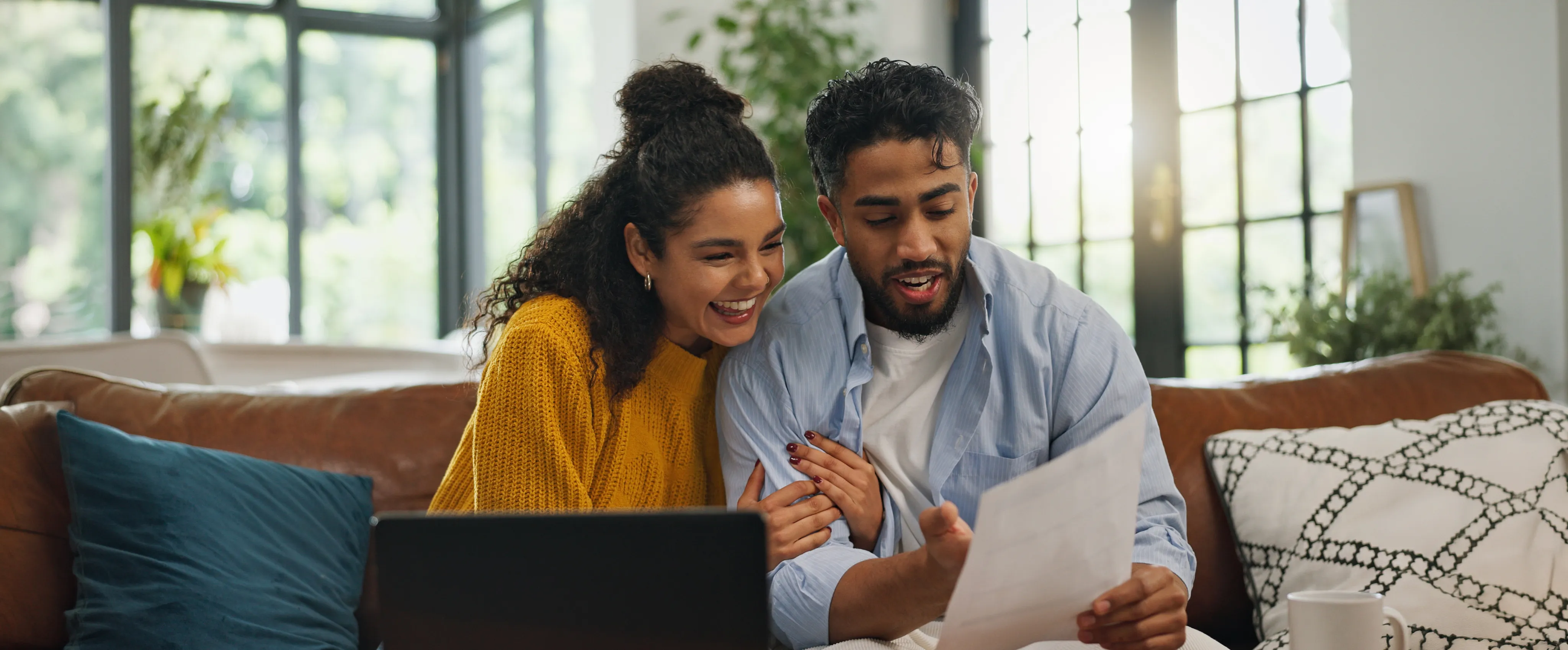 Happy couple reviewing mortgage paperwork